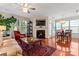 Spacious living room with fireplace, hardwood floors, and large windows at 804 Skybrook Falls Dr, Huntersville, NC 28078