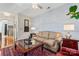 Living area with hardwood floors, built-in shelving, and fireplace at 804 Skybrook Falls Dr, Huntersville, NC 28078