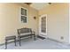 Private patio with bench and small table at 804 Skybrook Falls Dr, Huntersville, NC 28078