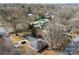 Aerial shot shows a pool nestled among the surrounding houses and lush greenery at 901 Maple Ave, Salisbury, NC 28144