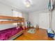 Bright bedroom features hardwood floors, a bunk bed, and a ceiling fan at 901 Maple Ave, Salisbury, NC 28144