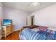 Relaxing bedroom with wood floors and a TV with beautiful beach view at 901 Maple Ave, Salisbury, NC 28144