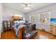 Charming bedroom with hardwood floors, ceiling fan, and plenty of natural light at 901 Maple Ave, Salisbury, NC 28144