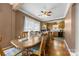 Cozy dining room with hardwood floors and a large table, flowing into the kitchen at 901 Maple Ave, Salisbury, NC 28144