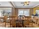 Charming dining room featuring hardwood floors, large windows, and seating for eight at 901 Maple Ave, Salisbury, NC 28144