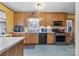 Traditional kitchen with wood cabinets, neutral countertops, and modern appliances at 901 Maple Ave, Salisbury, NC 28144