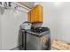 Functional laundry room features modern washer and dryer units and cabinet storage at 901 Maple Ave, Salisbury, NC 28144