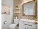 Stylish powder room with updated vanity and patterned wallpaper at 9236 Silver Pine Dr, Charlotte, NC 28277