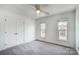 Well-lit bedroom with double door closet and two windows at 9236 Silver Pine Dr, Charlotte, NC 28277