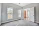 Spacious bedroom with carpet, neutral walls, and natural light at 9236 Silver Pine Dr, Charlotte, NC 28277