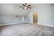 Spacious bedroom with gray carpet and ceiling fan at 9236 Silver Pine Dr, Charlotte, NC 28277