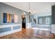 Bright dining room with hardwood floors and kitchen access at 9236 Silver Pine Dr, Charlotte, NC 28277