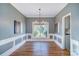 Elegant dining room with hardwood floors and chandelier at 9236 Silver Pine Dr, Charlotte, NC 28277