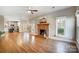 Open living room with hardwood floors and kitchen view at 9236 Silver Pine Dr, Charlotte, NC 28277