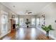 Spacious living room with hardwood floors, fireplace, and lots of natural light at 9236 Silver Pine Dr, Charlotte, NC 28277