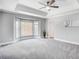 Spacious main bedroom with bay window and ceiling fan at 9236 Silver Pine Dr, Charlotte, NC 28277