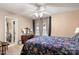 Serene bedroom with floral bedding, a dresser, and access to the bathroom at 10122 Oxford Landing Ln, Charlotte, NC 28270