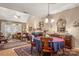 Charming dining room features a round table, chandelier, and access to kitchen at 10122 Oxford Landing Ln, Charlotte, NC 28270