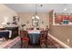 Elegant dining room features a round table, chandelier, and built-in cabinetry at 10122 Oxford Landing Ln, Charlotte, NC 28270