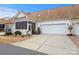 Townhouse exterior with a screened porch and attached garage at 10122 Oxford Landing Ln, Charlotte, NC 28270