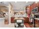 Well-equipped kitchen with wood cabinets, center island, and stainless steel appliances at 10122 Oxford Landing Ln, Charlotte, NC 28270