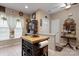 Kitchen with an island and views into another living space at 10122 Oxford Landing Ln, Charlotte, NC 28270