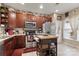 Bright kitchen featuring stainless steel appliances and dark wood cabinetry at 10122 Oxford Landing Ln, Charlotte, NC 28270