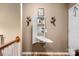 Convenient wall-mounted ironing board and storage shelves at 10122 Oxford Landing Ln, Charlotte, NC 28270