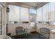 Cozy screened porch with two chairs and a small table at 10122 Oxford Landing Ln, Charlotte, NC 28270