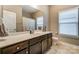 Bathroom with dark vanity, single sink and shower/tub combo at 1026 Slew O Gold Ln, Indian Trail, NC 28079