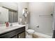 Clean bathroom with dark vanity, white toilet and shower/tub combo at 1026 Slew O Gold Ln, Indian Trail, NC 28079