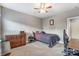 Bedroom with carpeted floors, dresser, and full bed at 1026 Slew O Gold Ln, Indian Trail, NC 28079