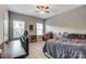 Bedroom with carpeted floors, built-in desk and full bed at 1026 Slew O Gold Ln, Indian Trail, NC 28079