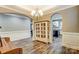 Formal dining room with hardwood floors, chandelier, and kitchen views at 1026 Slew O Gold Ln, Indian Trail, NC 28079