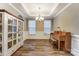 Elegant dining room with hardwood floors, chandelier, and built-in hutch at 1026 Slew O Gold Ln, Indian Trail, NC 28079