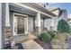 Inviting front porch with stone pillars and wicker chairs at 1026 Slew O Gold Ln, Indian Trail, NC 28079