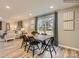 Dining area with rustic table, black chairs, and hardwood floors at 117 Mountain Bridge Way, Statesville, NC 28625