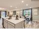 Kitchen island with sink, ample counter space, and breakfast bar at 117 Mountain Bridge Way, Statesville, NC 28625