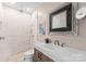 Modern bathroom with walk-in shower and floating vanity at 12217 Pine Valley Club Dr, Charlotte, NC 28277