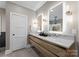 Modern bathroom with floating double vanity and marble countertop at 12217 Pine Valley Club Dr, Charlotte, NC 28277