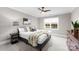 Cozy bedroom with queen bed and window view at 12217 Pine Valley Club Dr, Charlotte, NC 28277