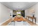 Elegant dining room with live edge table and statement lighting at 12217 Pine Valley Club Dr, Charlotte, NC 28277