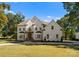 Two-story white brick house with landscaping and driveway at 12217 Pine Valley Club Dr, Charlotte, NC 28277