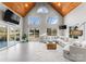 Bright living room with vaulted ceiling, hardwood floors and wall of windows at 12217 Pine Valley Club Dr, Charlotte, NC 28277