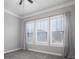 Bedroom with grey walls, grey carpet, and three windows at 131 E Northstone Rd, Mooresville, NC 28115