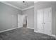 Grey bedroom with double door closet and carpet flooring at 131 E Northstone Rd, Mooresville, NC 28115