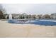 Community pool with safety cover and surrounding patio at 131 E Northstone Rd, Mooresville, NC 28115