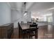 Dining room with farmhouse table and chairs, open to the kitchen at 131 E Northstone Rd, Mooresville, NC 28115