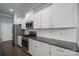 Modern kitchen with stainless steel appliances and white shaker cabinets at 131 E Northstone Rd, Mooresville, NC 28115