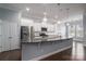 Modern kitchen with large island, stainless steel appliances, and white cabinets at 131 E Northstone Rd, Mooresville, NC 28115